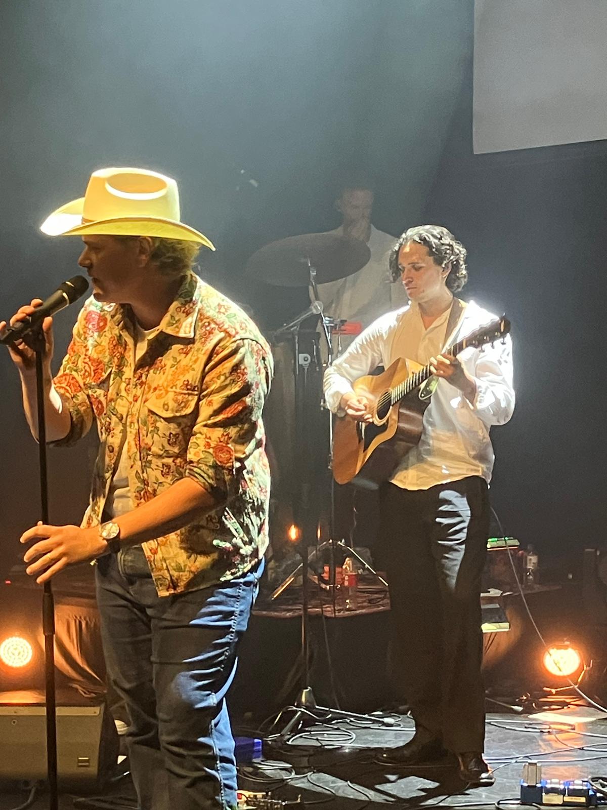 Ian Storm performing with a band