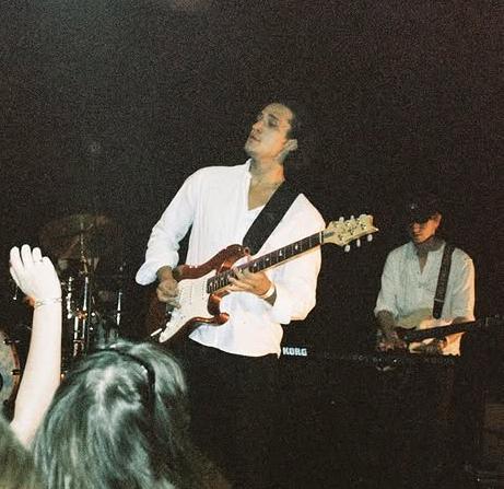 Ian Storm playing guitar live